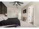Bedroom featuring a ceiling fan, a wall-mounted television, and an ensuite bathroom for comfort at 25875 S 227Th Way, Queen Creek, AZ 85142