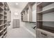 Spacious walk-in closet with custom built-in shelving and ample storage space at 25875 S 227Th Way, Queen Creek, AZ 85142