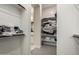 Walk-in closet offering custom shelving and storage solutions for organization at 25875 S 227Th Way, Queen Creek, AZ 85142