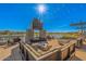 Outdoor community space overlooking the lake with fireplace, seating, and strung lights at 25875 S 227Th Way, Queen Creek, AZ 85142
