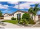Well-kept single-Gathering home featuring a three-car garage, manicured lawn, and drought-resistant desert landscaping at 25875 S 227Th Way, Queen Creek, AZ 85142