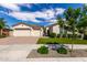 Attractive single-Gathering home with a three-car garage, neat landscaping, and a welcoming desert-style front yard at 25875 S 227Th Way, Queen Creek, AZ 85142