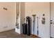Garage interior featuring a water heater, water softener, and storage for cleaning supplies at 25875 S 227Th Way, Queen Creek, AZ 85142