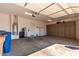 Spacious garage with ample storage cabinets, water heater, and room for multiple vehicles at 25875 S 227Th Way, Queen Creek, AZ 85142