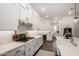 Bright, modern kitchen with sleek countertops, white cabinetry, and stainless steel appliances at 25875 S 227Th Way, Queen Creek, AZ 85142