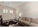 Bright living room with hardwood floors, a sofa, and ample lighting at 25875 S 227Th Way, Queen Creek, AZ 85142