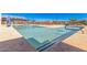 Beautiful community pool with clear blue water, comfortable seating, and shade umbrellas for a relaxing experience at 25875 S 227Th Way, Queen Creek, AZ 85142