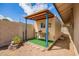 Backyard Shed with rustic roofing offering a unique storage solution, and a touch of creativity to the outdoor space at 2745 S Emerson Cir, Mesa, AZ 85210