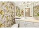 Cozy bathroom with a mirror, vanity, toilet, and cactus-themed shower curtain at 2745 S Emerson Cir, Mesa, AZ 85210
