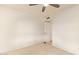 Empty bedroom with carpet, a ceiling fan, and blank white walls at 2745 S Emerson Cir, Mesa, AZ 85210