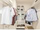 Walk-in closet with ample shelving, hanging racks, and shoe storage at 2745 S Emerson Cir, Mesa, AZ 85210