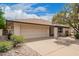 Attractive single-story home boasts a large garage and a covered patio area, great curb appeal at 2745 S Emerson Cir, Mesa, AZ 85210