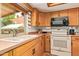 Well-lit kitchen features a double sink, modern appliances, and ample cabinet space at 2745 S Emerson Cir, Mesa, AZ 85210