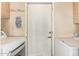 Bright laundry room features a door, washer, and a dryer at 2745 S Emerson Cir, Mesa, AZ 85210