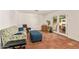 Comfortable living area with tile flooring, access to the patio, and a stylish patterned sofa at 2745 S Emerson Cir, Mesa, AZ 85210