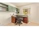 Office features built-in cabinets, an desk, and a comfortable office chair at 2745 S Emerson Cir, Mesa, AZ 85210