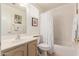 Well-lit bathroom with a shower-tub combo and a vanity featuring modern hardware at 2926 N 149Th Dr, Goodyear, AZ 85395