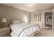 Cozy bedroom features natural lighting, a comfortable bed, and tranquil decor at 2926 N 149Th Dr, Goodyear, AZ 85395