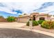 Inviting single-story home featuring desert landscaping, a spacious driveway, and a convenient attached two-car garage at 2926 N 149Th Dr, Goodyear, AZ 85395