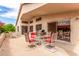Covered patio with multiple seating areas is great for entertaining outdoors at 2926 N 149Th Dr, Goodyear, AZ 85395