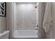 Cozy bathroom with a classic shower-tub combination and white tiling at 3033 N 39Th St # 5, Phoenix, AZ 85018