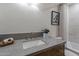 Classic bathroom with a gray countertop, white sink, and a framed art piece at 3033 N 39Th St # 5, Phoenix, AZ 85018