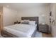 Bedroom with a large bed, neutral decor, and natural light streaming through two light fixtures at 3033 N 39Th St # 5, Phoenix, AZ 85018