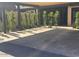 Carport featuring a shaded parking area with modern design and manicured landscaping at 3033 N 39Th St # 5, Phoenix, AZ 85018
