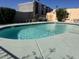 Community pool featuring clear blue water, lounging chairs, and a fenced perimeter at 3033 N 39Th St # 5, Phoenix, AZ 85018