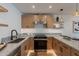 Kitchen with light wood cabinets, stainless steel appliances, a U-shaped layout, and stylish pendant lighting at 3033 N 39Th St # 5, Phoenix, AZ 85018
