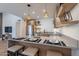 Kitchen with light wood cabinets, stainless steel appliances, pendant lighting, and a counter with barstool seating at 3033 N 39Th St # 5, Phoenix, AZ 85018