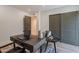 Office space featuring a desk, chair, accent chair, sliding closet doors, neutral rug, and natural light from a nearby window at 3033 N 39Th St # 5, Phoenix, AZ 85018