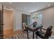 Bright office with sliding closet door, window, modern desk, chair, and neutral rug at 3033 N 39Th St # 5, Phoenix, AZ 85018