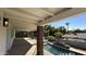 Spacious back porch overlooking the pool, palm trees, and serene backyard at 333 W Bethany Home Rd, Phoenix, AZ 85013