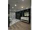 Modern bathroom boasts a glass shower, soaking tub, marble accent wall, and a double sink vanity at 333 W Bethany Home Rd, Phoenix, AZ 85013