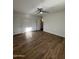 Well-lit bedroom with modern ceiling fan, wood floors, and closet at 333 W Bethany Home Rd, Phoenix, AZ 85013