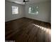 Light filled bedroom with wood floors and dual windows at 333 W Bethany Home Rd, Phoenix, AZ 85013