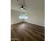 Spacious bedroom with modern ceiling fan, wood floors, and natural light at 333 W Bethany Home Rd, Phoenix, AZ 85013