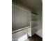Walk-in closet featuring custom shelves and wooden rods at 333 W Bethany Home Rd, Phoenix, AZ 85013