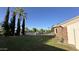 Expansive front yard with lush green grass, mature trees and elegant landscaping at 333 W Bethany Home Rd, Phoenix, AZ 85013