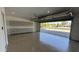 Well-lit garage featuring epoxy flooring, built-in cabinets and view of neighborhood at 333 W Bethany Home Rd, Phoenix, AZ 85013