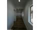 Hallway with wood floors leading to rooms filled with natural light at 333 W Bethany Home Rd, Phoenix, AZ 85013