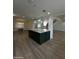 Kitchen with large island, stainless steel appliances, and open floor plan at 333 W Bethany Home Rd, Phoenix, AZ 85013