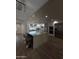 Large kitchen island with seating, stainless steel appliances, and modern lighting fixtures at 333 W Bethany Home Rd, Phoenix, AZ 85013