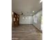Bright living area with hardwood floors, ceiling fan, partition wall, recessed lighting, and access to patio at 333 W Bethany Home Rd, Phoenix, AZ 85013