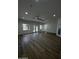 Spacious living room with hardwood floors, neutral paint, ceiling fan and lots of natural light at 333 W Bethany Home Rd, Phoenix, AZ 85013