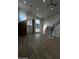 Expansive living room featuring a striking brick accent wall and staircase at 333 W Bethany Home Rd, Phoenix, AZ 85013