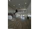 Expansive living room with high ceilings, wood floors, a staircase, and a view of the kitchen at 333 W Bethany Home Rd, Phoenix, AZ 85013
