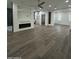 Open concept bedroom features hardwood floors, recessed lighting, sleek fireplace, glass shower, and walk-in closet at 333 W Bethany Home Rd, Phoenix, AZ 85013