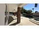 Covered patio with stone columns overlooking a tranquil pool and lush landscaping, perfect for outdoor entertaining at 333 W Bethany Home Rd, Phoenix, AZ 85013